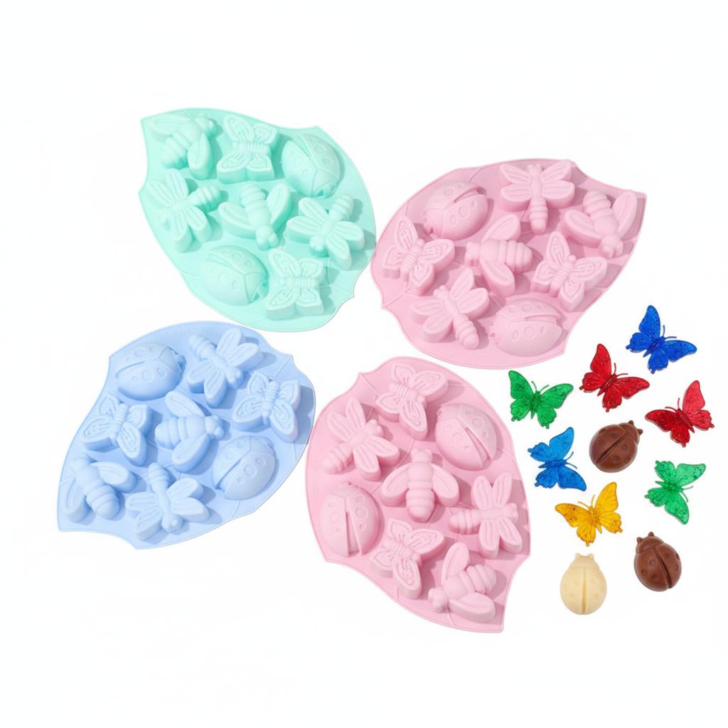 Butterfly and insect silicone mold with colorful resin pieces on white background