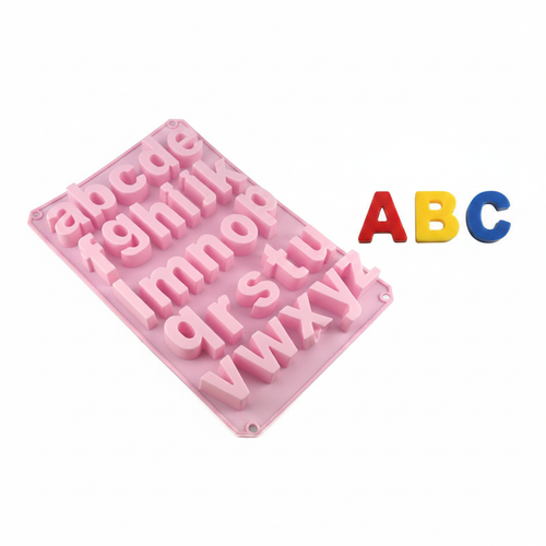 Alphabet silicone mold with colorful letter chocolates spelling ABC on white background